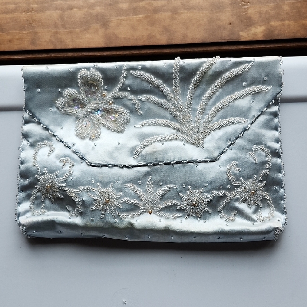 Elegant Satin Blue Wristlet with Intricate Floral Bead Design